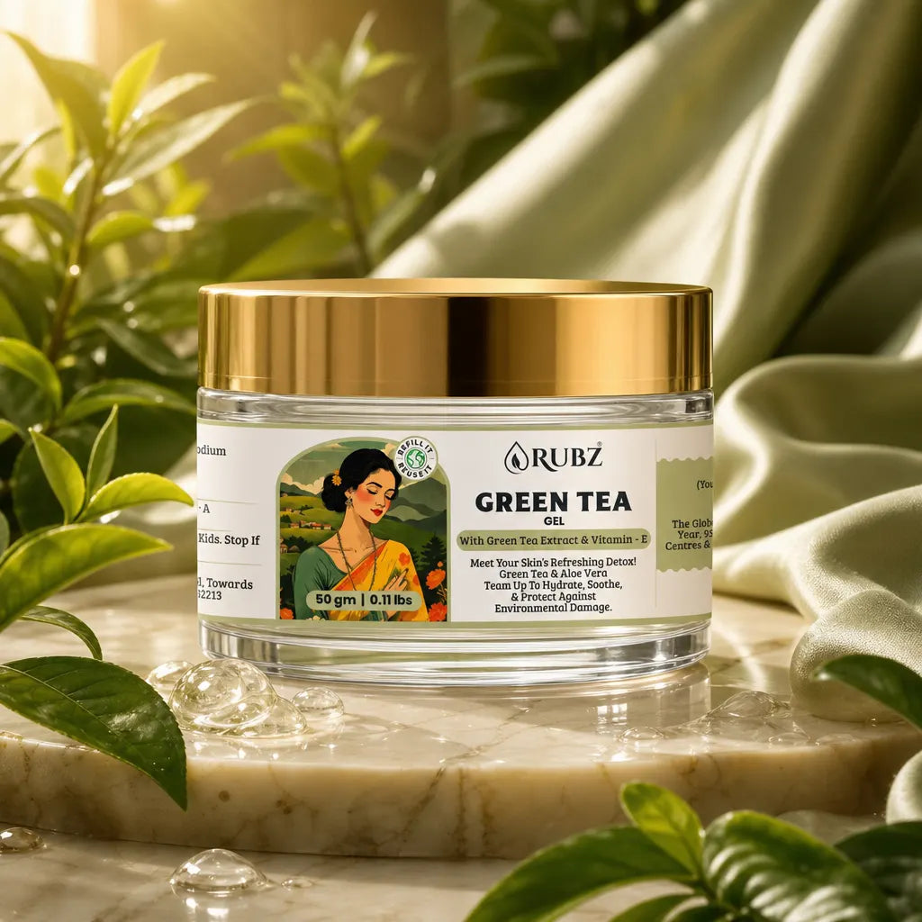 Jar of Rubz Green Tea Gel with a gold lid on a marble surface surrounded by green plants.