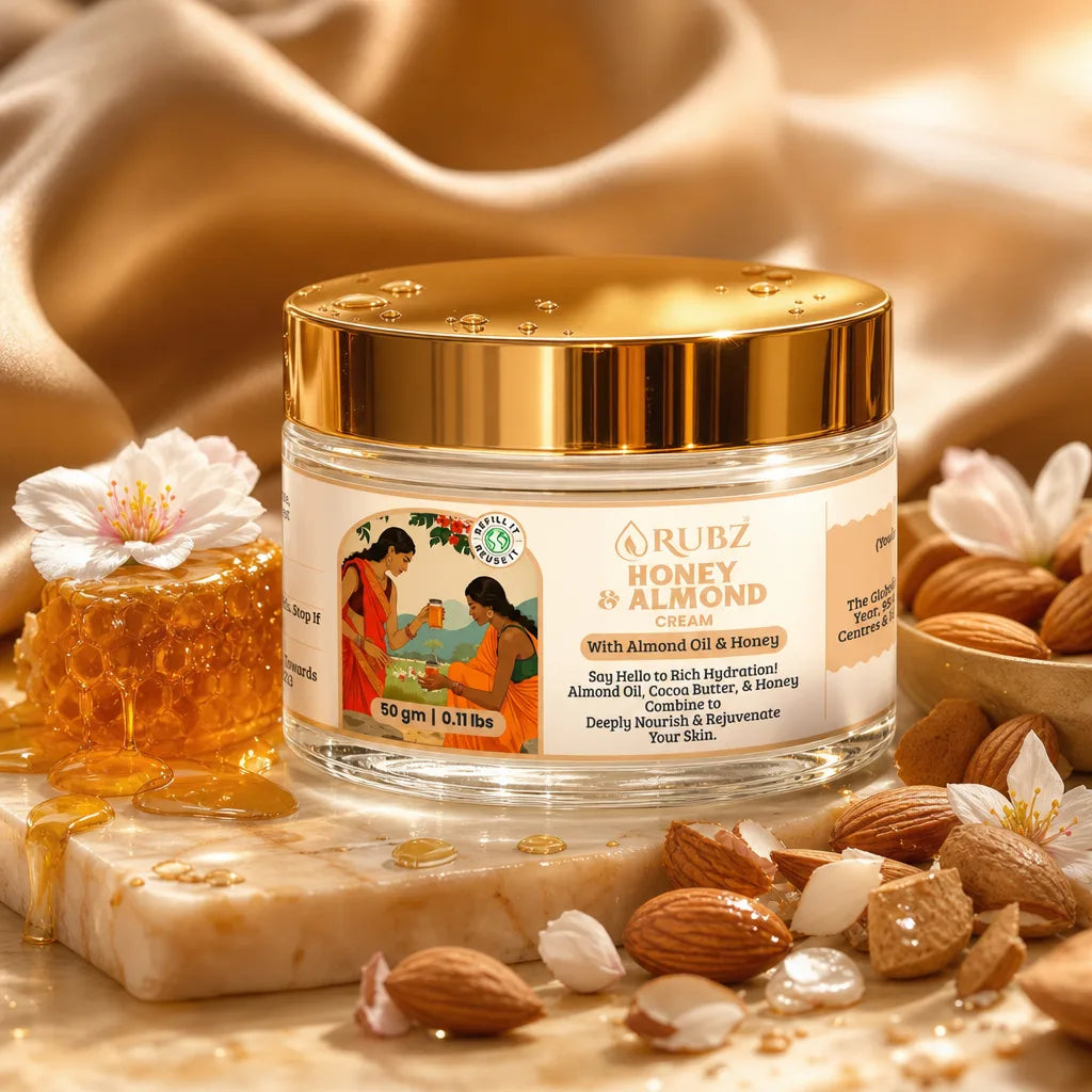 Jar of Rubz Honey & Almond cream with honeycomb, almonds, and flowers on a beige fabric background