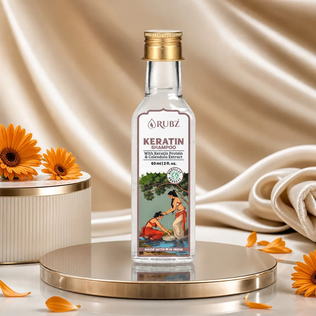 Rubz Keratin Shampoo bottle on a decorative platform with flowers and fabric in the background