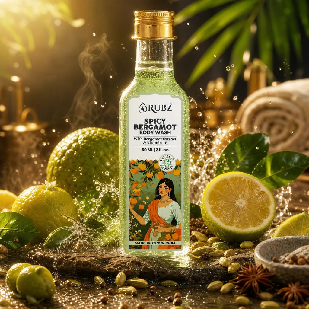 Bottle of Rubz Spicy Bergamot body wash surrounded by lemons, limes, and spices with a warm glow.